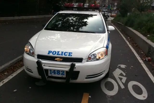 Photo of the NYPD patrolling the newly dedicated bike lane at Canal &amp; Chrystie via Buzzfeed.